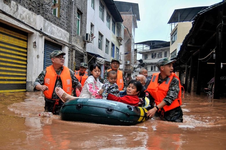 China flood latest news: Downpours to continue raging, China raises flood alert to second highest level 1803 china flood massive flood